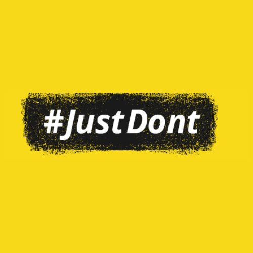Yellow background with #JustDont in white